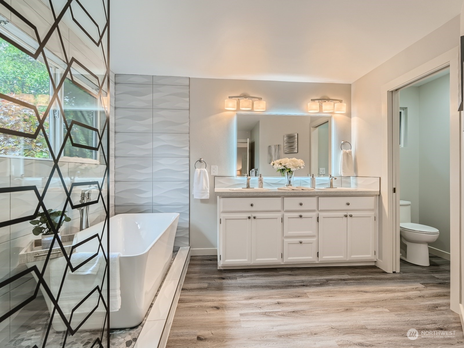 11216 39th Drive Southeast Everett, WA 98208 - Photo 22 of 40 a spacious bathroom with a granite countertop sink and a mirror