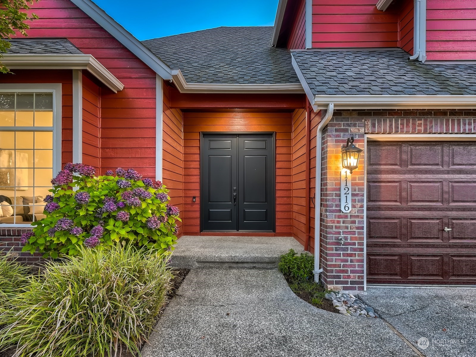 11216 39th Drive Southeast Everett, WA 98208 - Photo 3 of 40 a front view of a house with garden