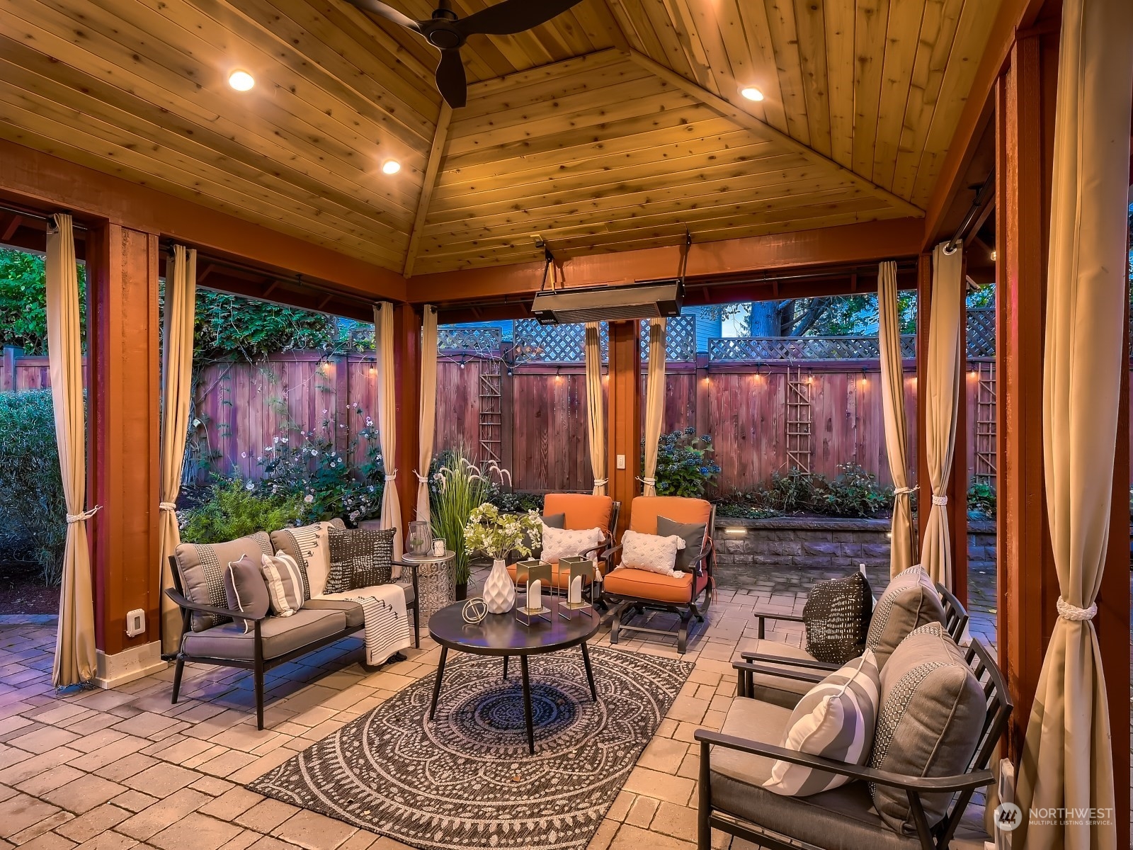 11216 39th Drive Southeast Everett, WA 98208 - Photo 31 of 40 a outdoor space with patio couches and a dining table and chairs with potted plants