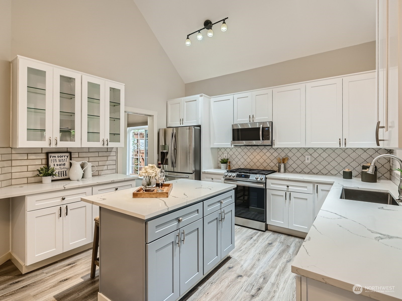 11216 39th Drive Southeast Everett, WA 98208 - Photo 9 of 40 a kitchen with a sink stove a microwave and refrigerator