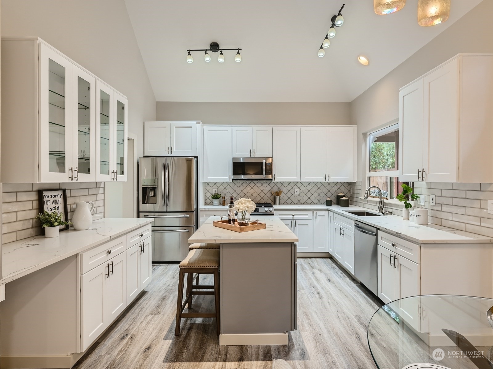 11216 39th Drive Southeast Everett, WA 98208 - Photo 10 of 40 a kitchen with a sink stove cabinets and refrigerator