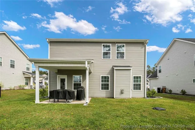a view of a house with yard and front view of a house