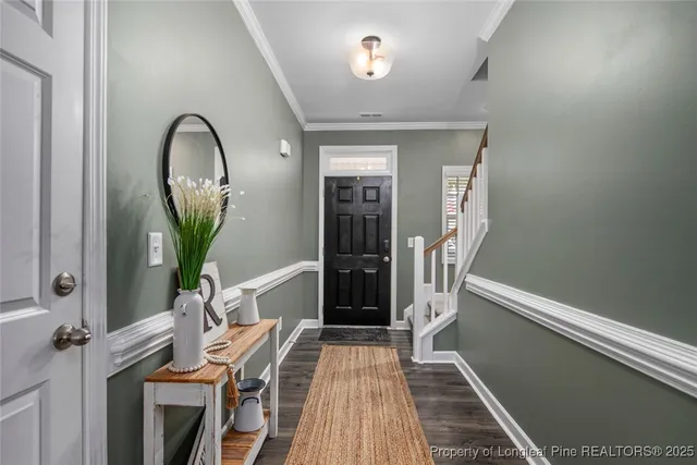 a view of a livingroom with furniture and entryway