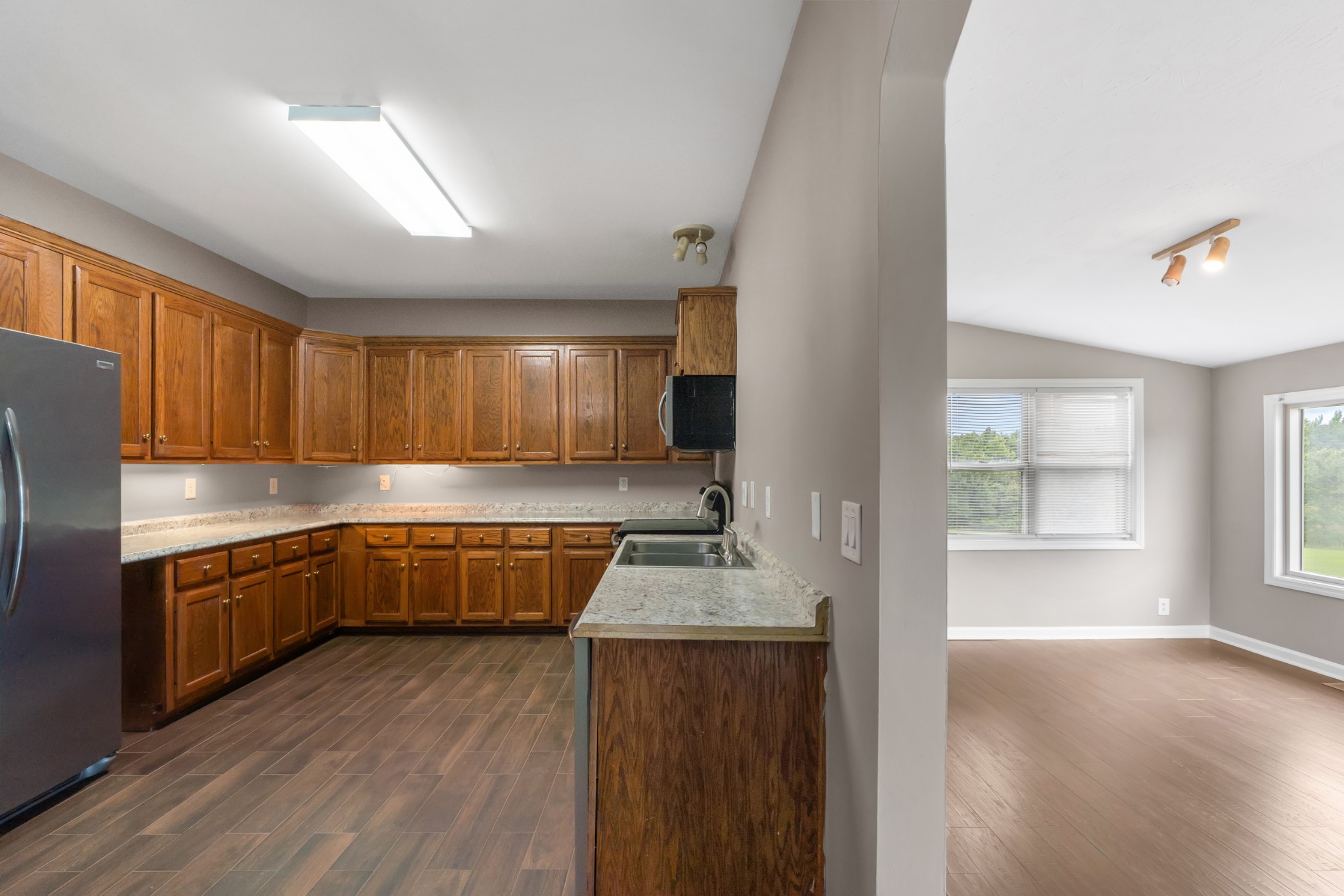 4602 Washington Road Springfield, TN 37172 - Photo 13 of 63 a kitchen with stainless steel appliances granite countertop a sink refrigerator and cabinets