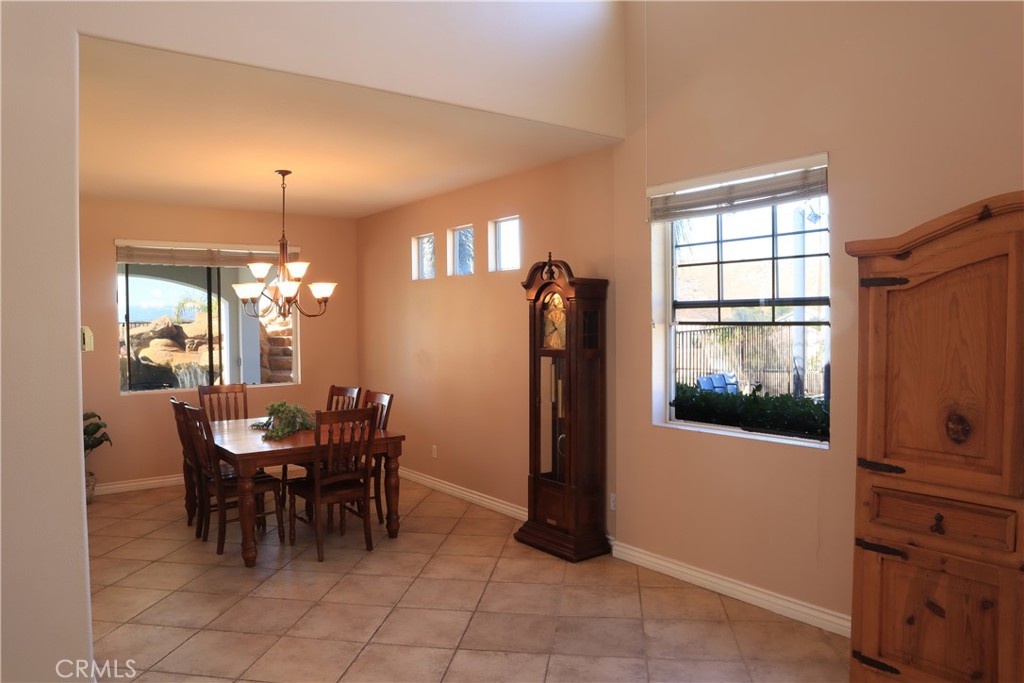 28469 Via Joyce Drive Saugus, CA 91350 - Photo 13 of 23 a view of a dining room with furniture and chandelier
