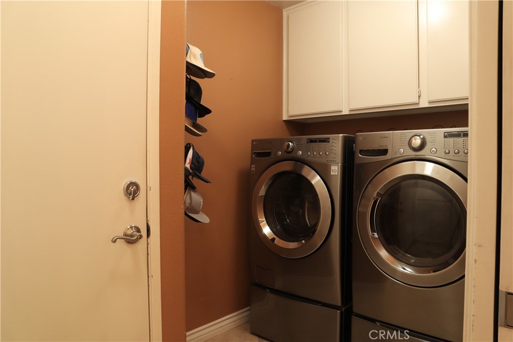 28469 Via Joyce Drive Saugus, CA 91350 - Photo 20 of 23 a utility room with dryer and washer