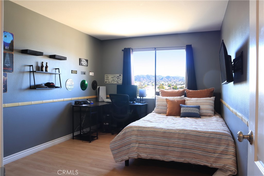 28469 Via Joyce Drive Saugus, CA 91350 - Photo 22 of 23 a bedroom with a large bed and a large window