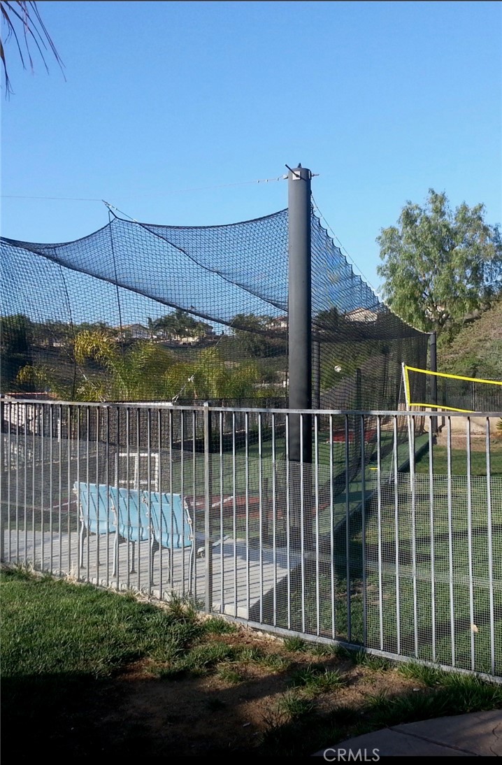 28469 Via Joyce Drive Saugus, CA 91350 - Photo 5 of 23 a view of a house with a floor to ceiling window and wooden fence