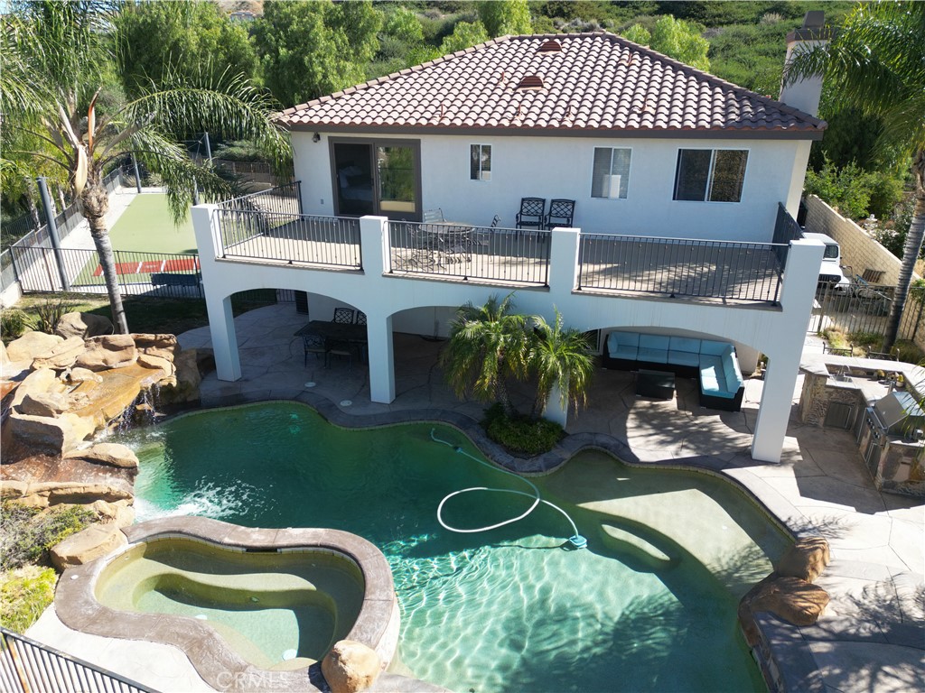 28469 Via Joyce Drive Saugus, CA 91350 - Photo 7 of 23 a view of a house with backyard porch and sitting area