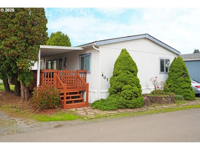 a backyard of a house with plants and entertaining space