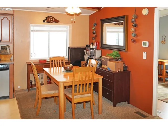 a dining room with furniture and window