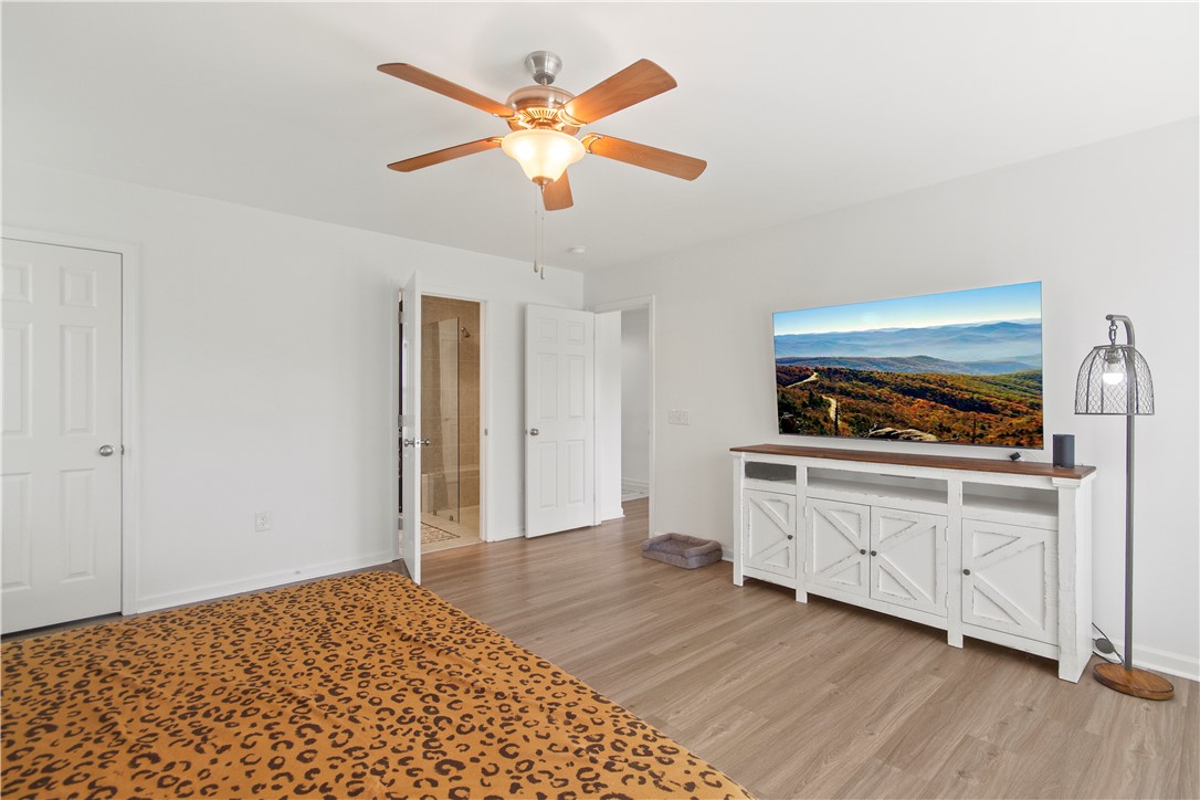 2900 Highway 187 Anderson, SC 29626 - Photo 29 of 41 Relax in a bedroom with natural light and easy access to an ensuite bathroom.