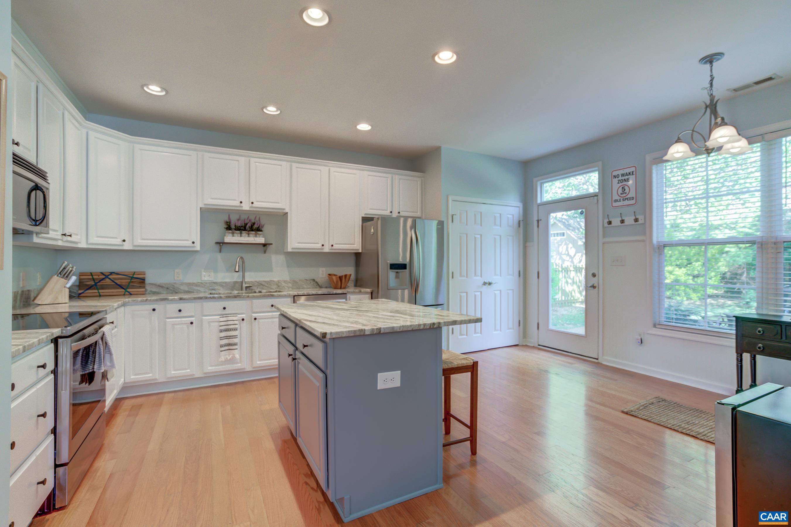 5448 Park Road Crozet, VA 22932 - Photo 15 of 28 a kitchen with kitchen island granite countertop appliances cabinets and a sink
