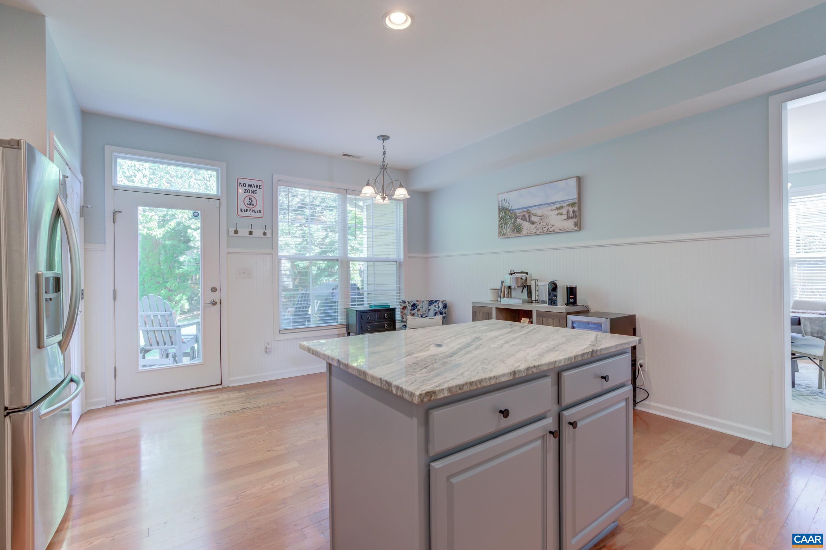 5448 Park Road Crozet, VA 22932 - Photo 18 of 28 a view of kitchen island a sink wooden floor and a refrigerator