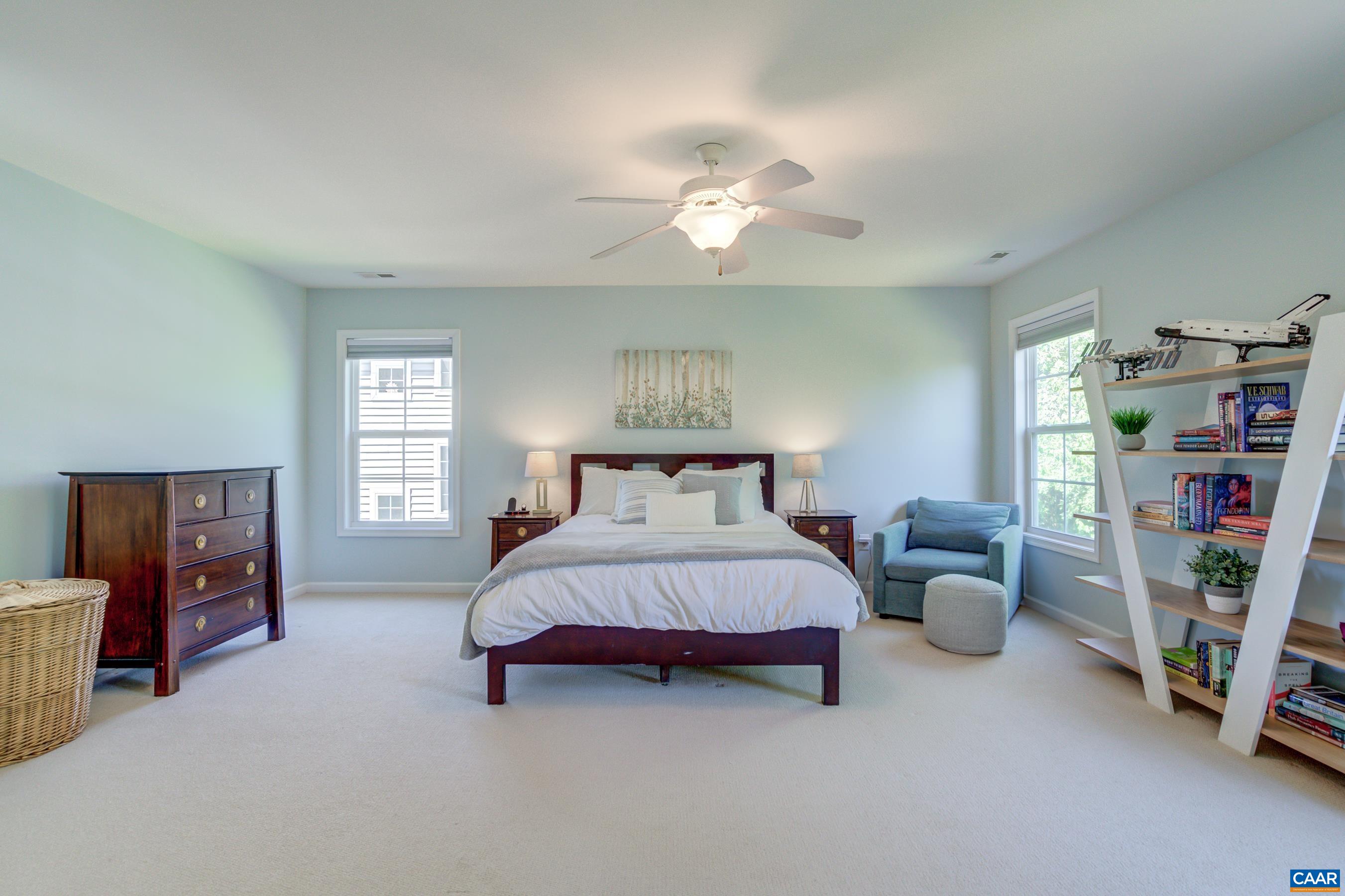 5448 Park Road Crozet, VA 22932 - Photo 22 of 28 a spacious bedroom with a bed and a window