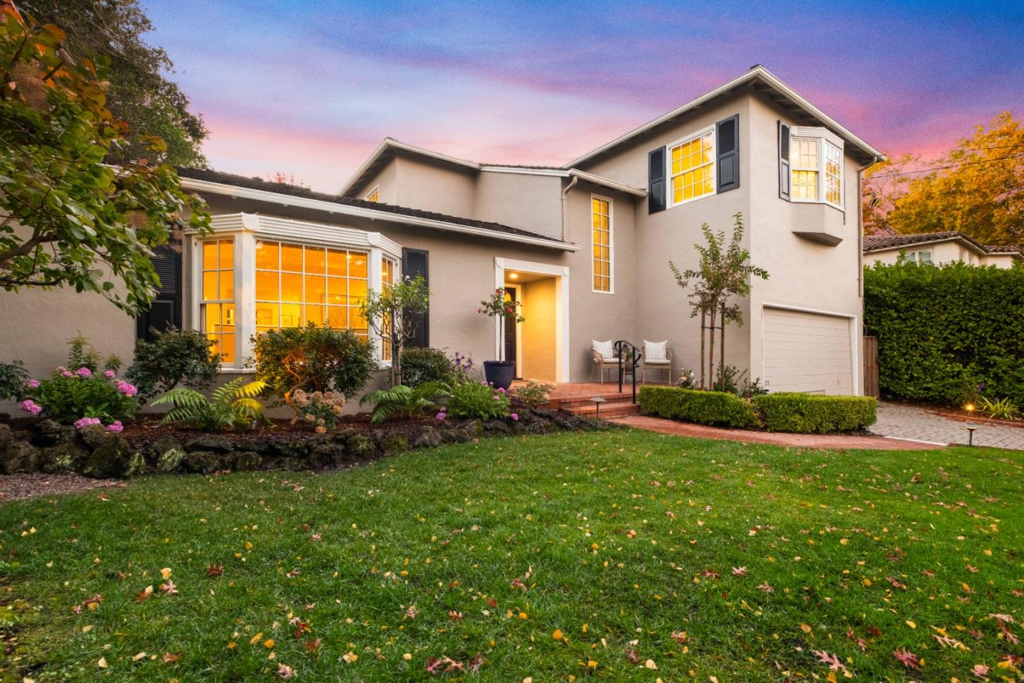 425 Dorchester Road San Mateo, CA 94402 - Photo 1 of 61 a front view of a house with a garden and plants
