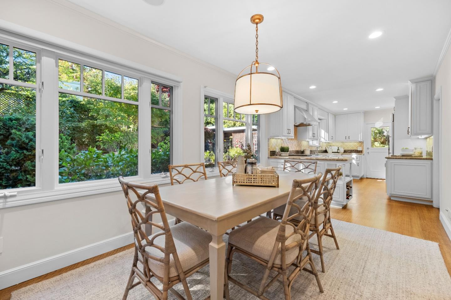 425 Dorchester Road San Mateo, CA 94402 - Photo 12 of 61 a view of a dining room and livingroom with furniture wooden floor a chandelier