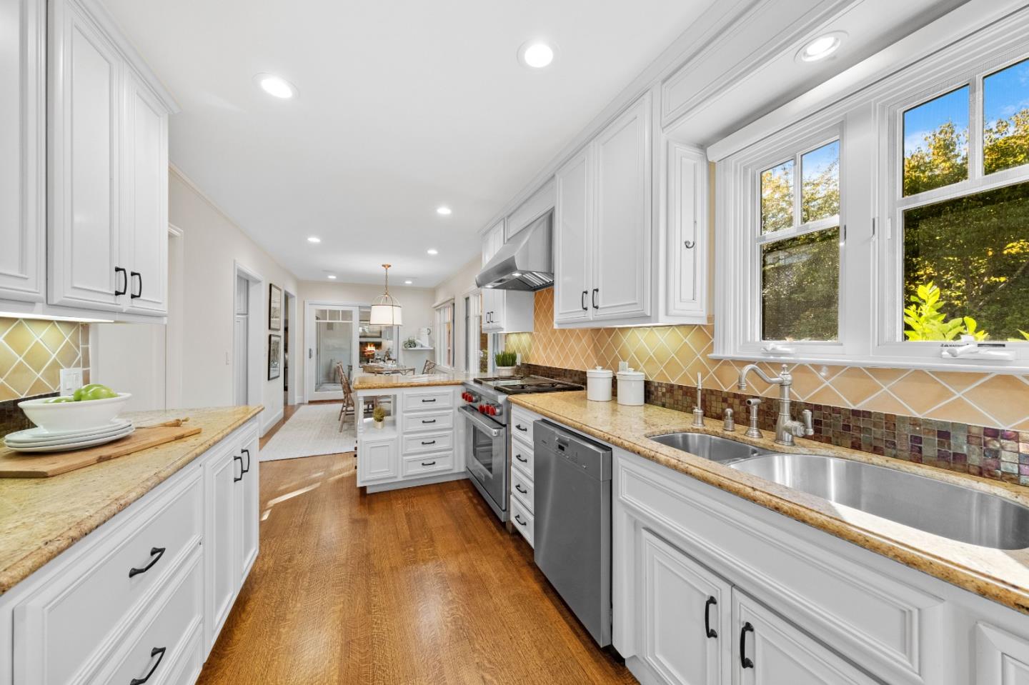 425 Dorchester Road San Mateo, CA 94402 - Photo 14 of 61 a large kitchen with stainless steel appliances granite countertop a lot of counter space and a sink