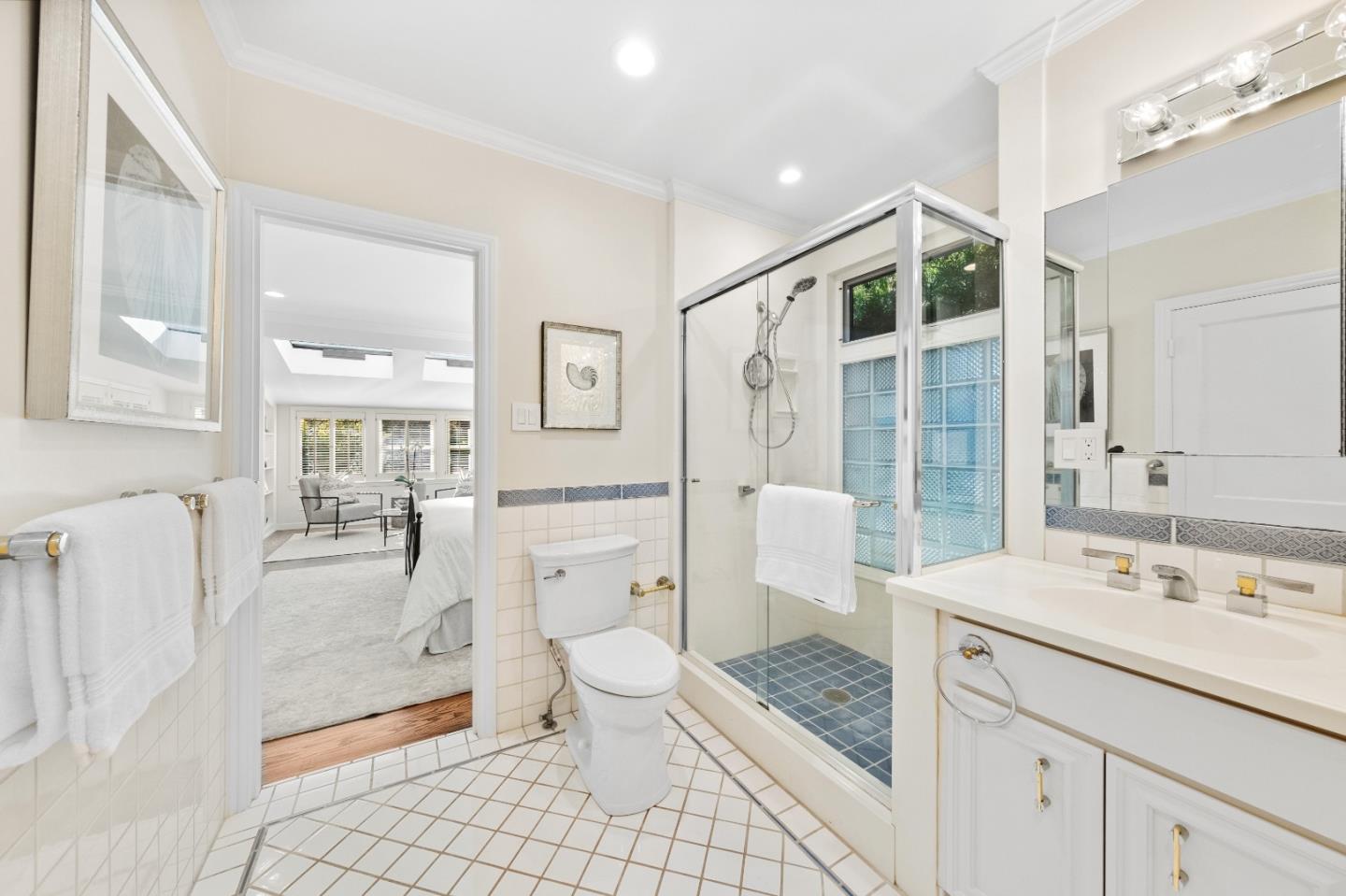 425 Dorchester Road San Mateo, CA 94402 - Photo 30 of 61 a spacious bathroom with a granite countertop sink toilet and shower