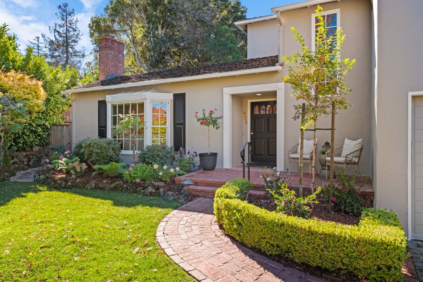 425 Dorchester Road San Mateo, CA 94402 - Photo 3 of 61 a front view of a house with a yard