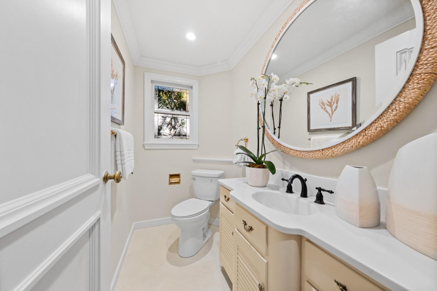 425 Dorchester Road San Mateo, CA 94402 - Photo 40 of 61 a bathroom with a sink a toilet and a mirror