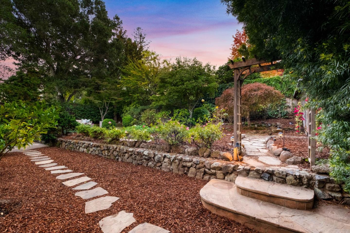 425 Dorchester Road San Mateo, CA 94402 - Photo 42 of 61 a view of a table and chairs in a garden