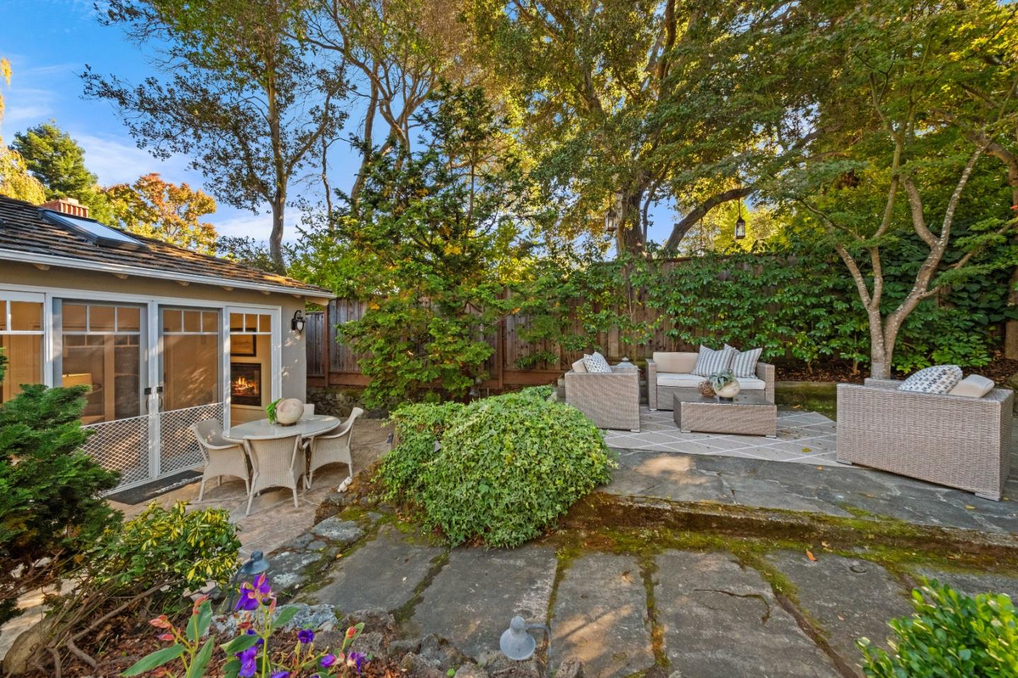 425 Dorchester Road San Mateo, CA 94402 - Photo 48 of 61 a view of a patio with couches table and chairs and potted plants