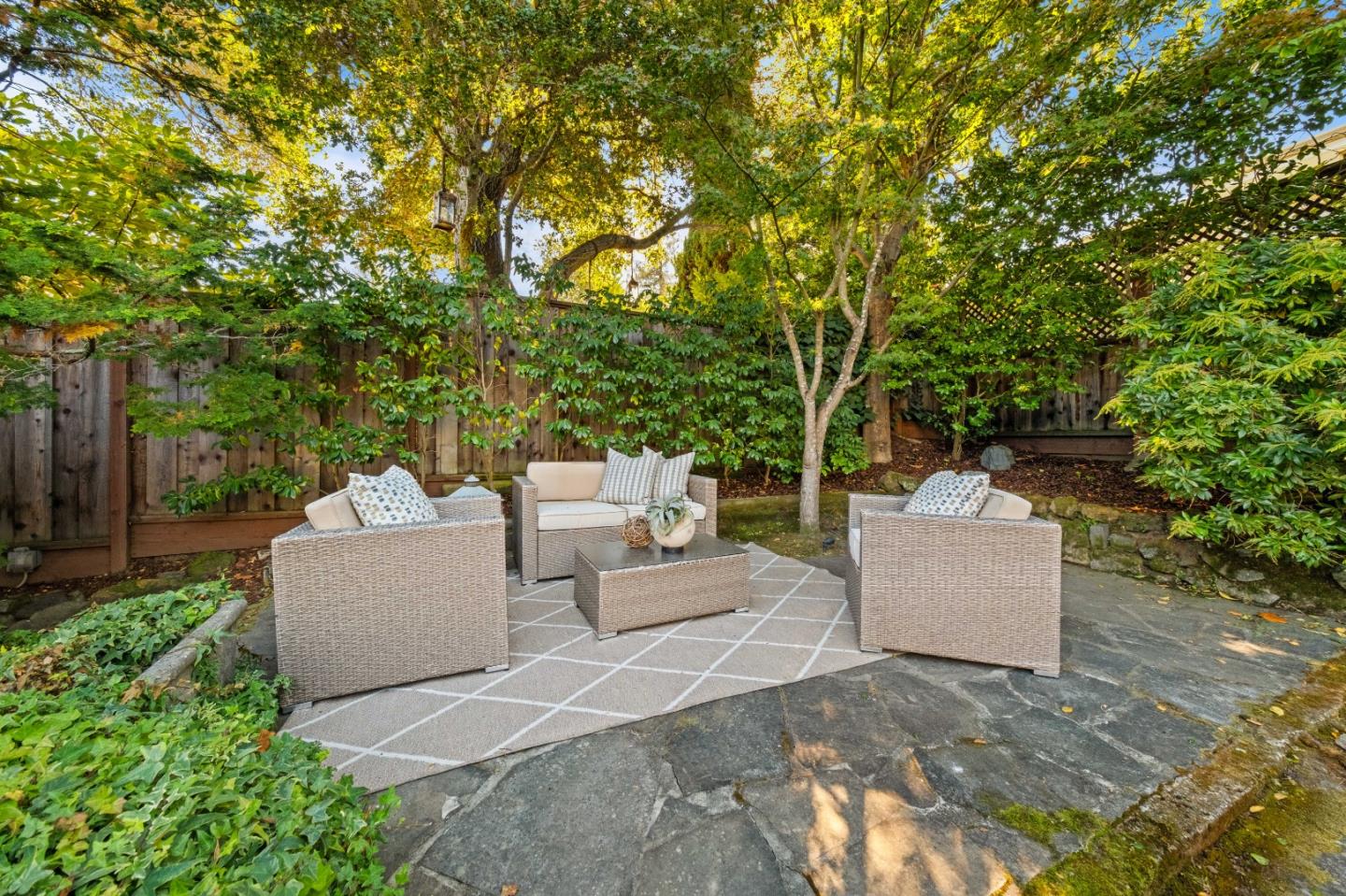 425 Dorchester Road San Mateo, CA 94402 - Photo 49 of 61 a view of a patio with couches and a large tree