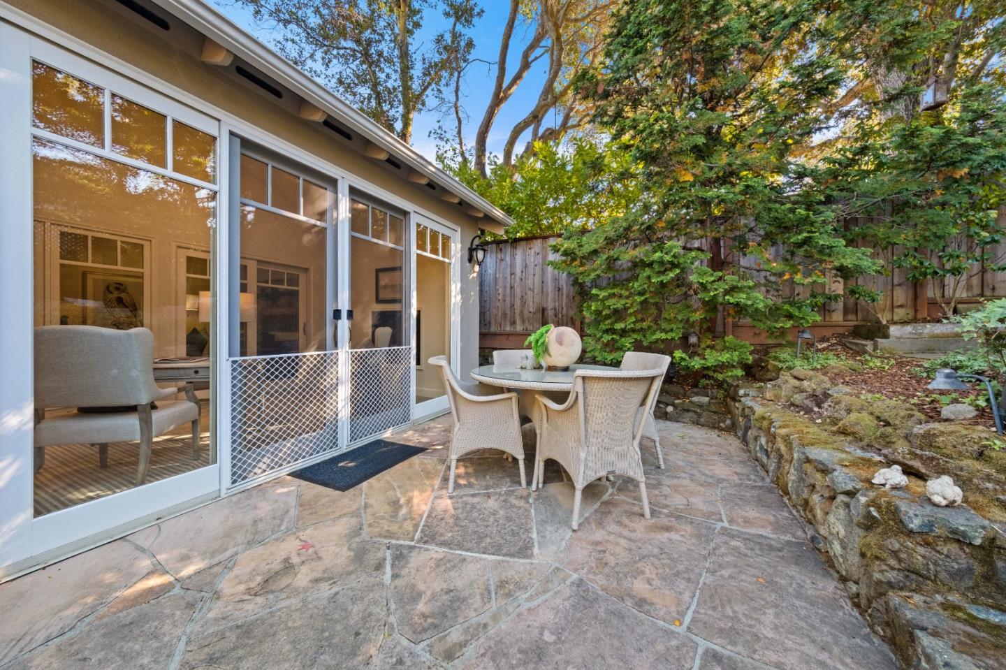 425 Dorchester Road San Mateo, CA 94402 - Photo 51 of 61 a view of a patio with table and chairs and potted plants