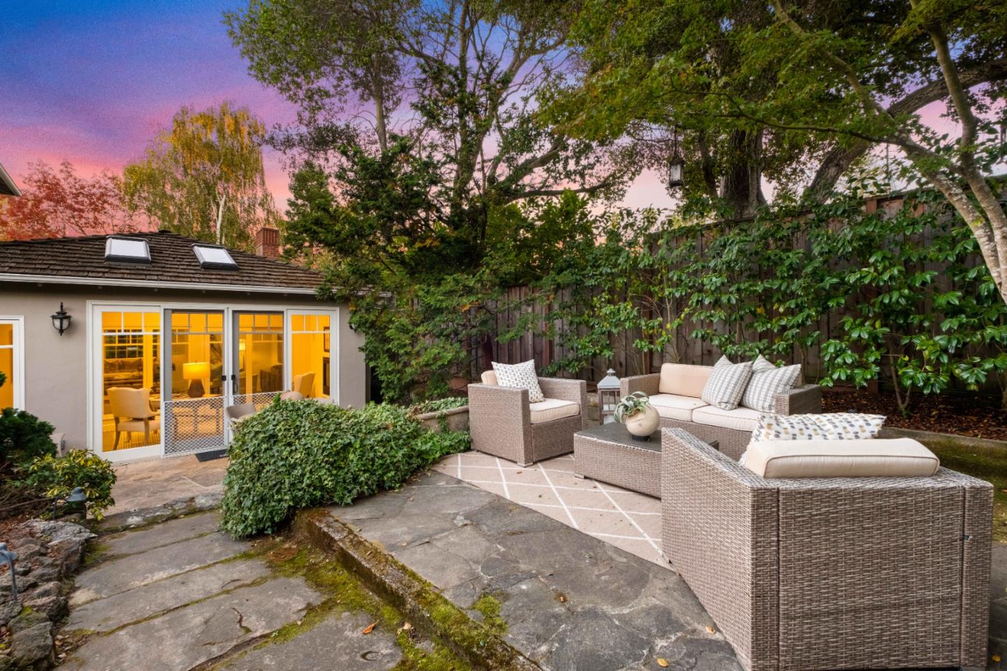 425 Dorchester Road San Mateo, CA 94402 - Photo 57 of 61 a view of a patio with couches table and chairs and potted plants