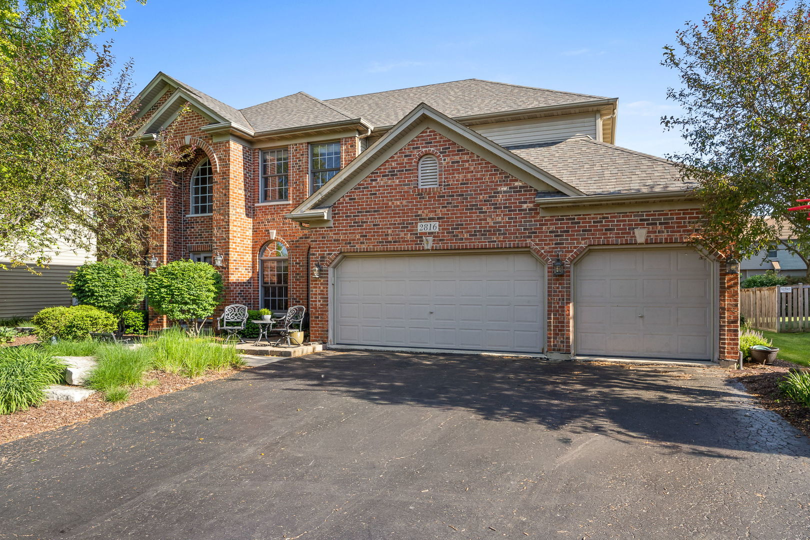 2816 Cordgrass Road Naperville, IL 60564 - Photo 46 of 49 a front view of a house with a yard and garage