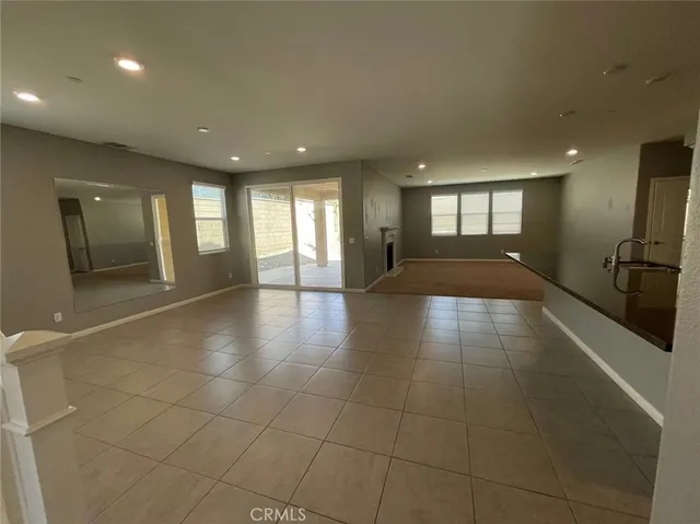 a view of a hallway with stairs