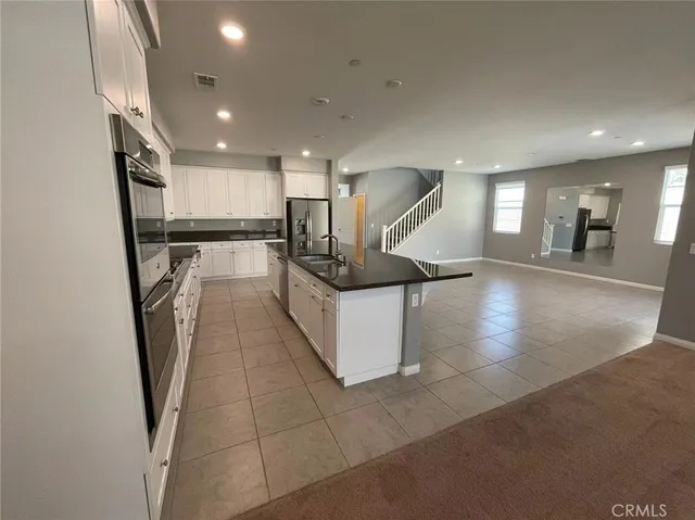 a view of a kitchen with a sink