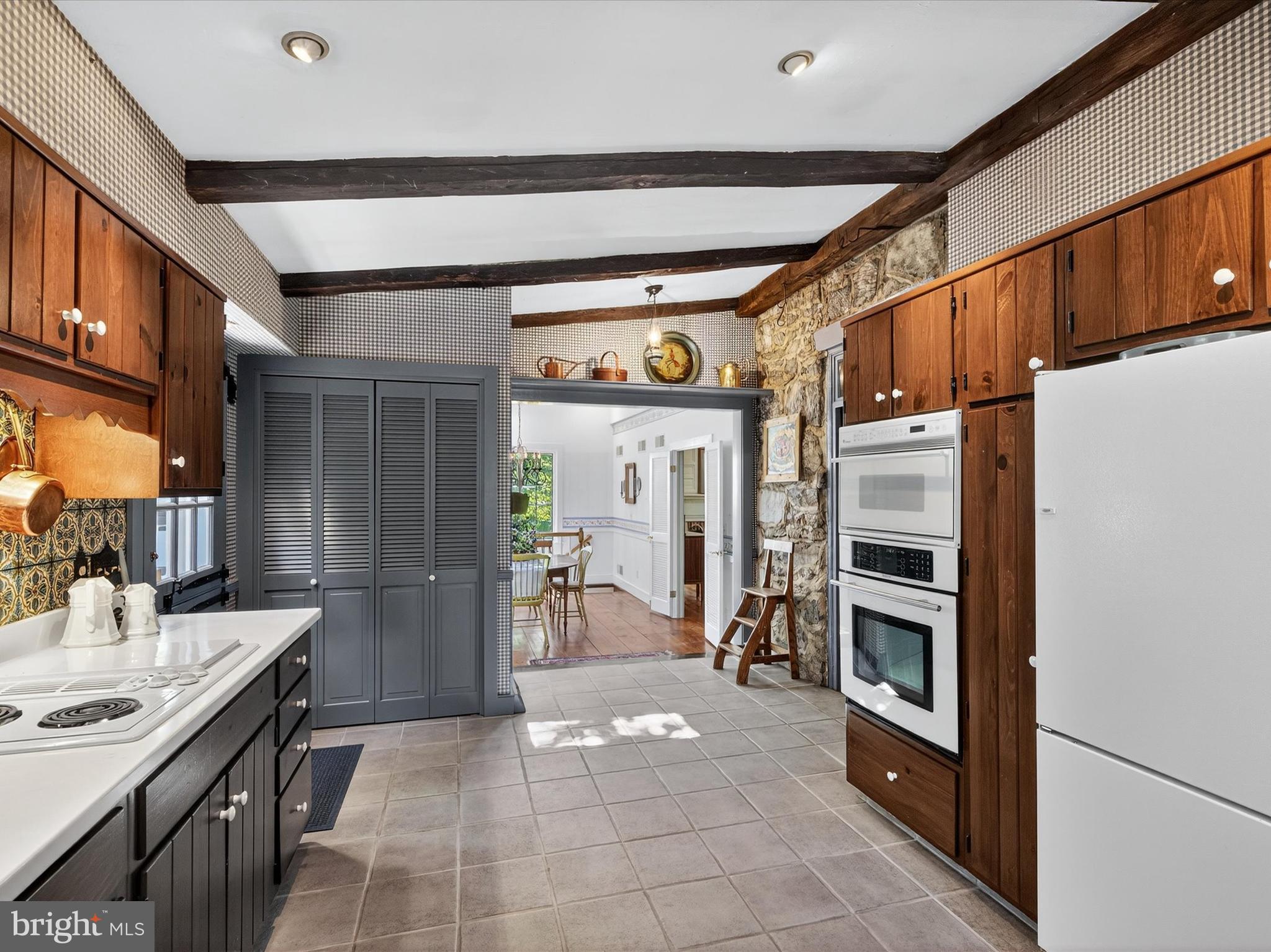 265 North Old Stonehouse Road South Carlisle, PA 17015 - Photo 35 of 100 a kitchen with granite countertop a refrigerator and a stove