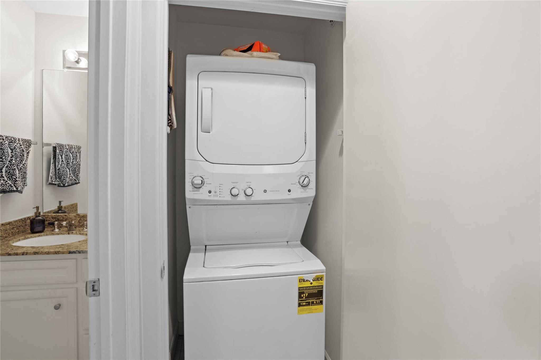 2710 Hullsmith Drive, Unit 604 Houston, TX 77063 - Photo 14 of 27 a utility room with dryer and washer