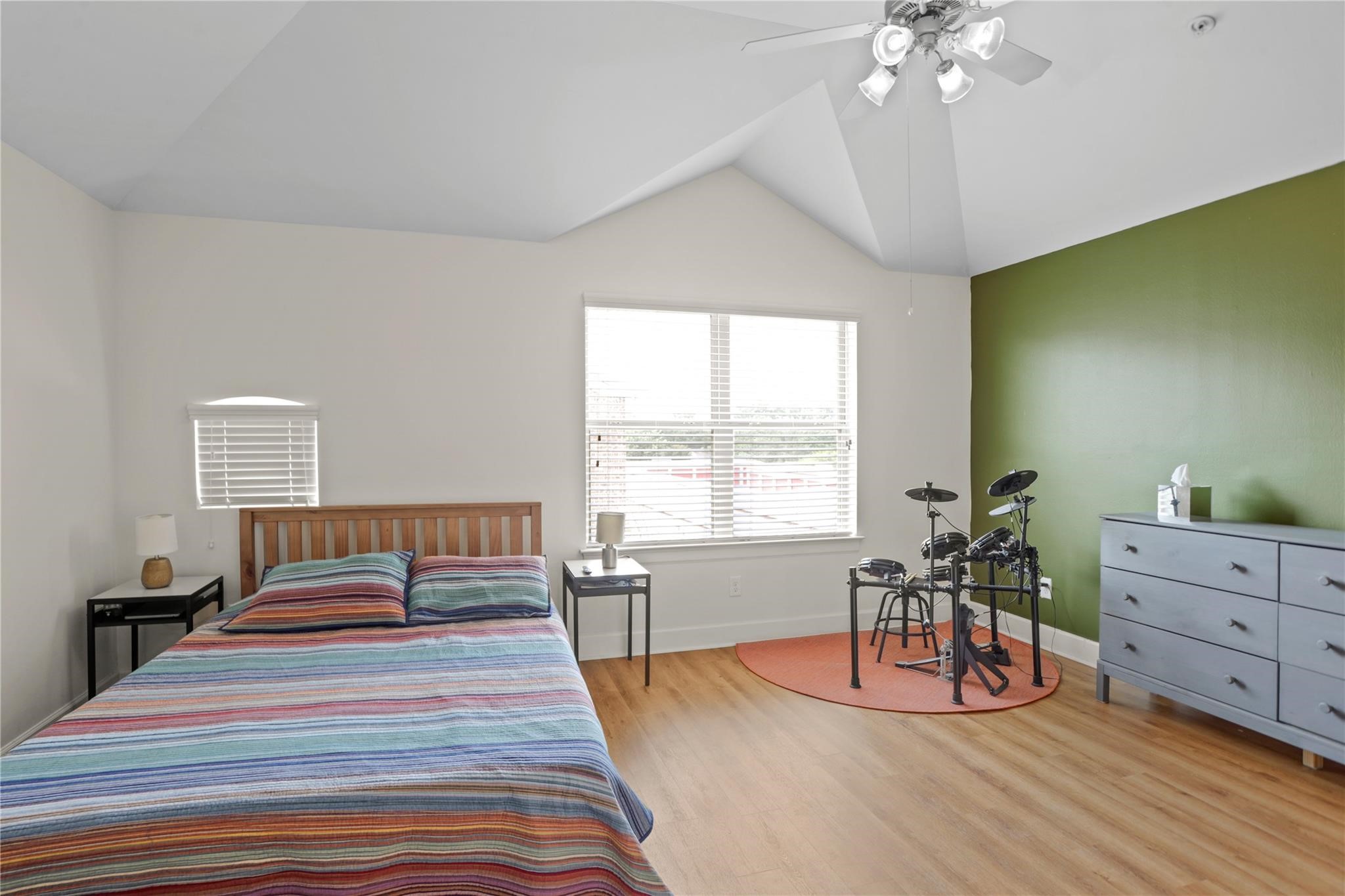 2710 Hullsmith Drive, Unit 604 Houston, TX 77063 - Photo 16 of 27 a bedroom with a bed and wooden floor