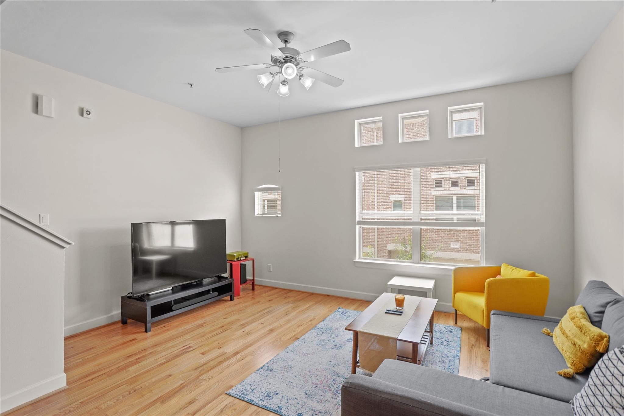 2710 Hullsmith Drive, Unit 604 Houston, TX 77063 - Photo 8 of 27 a living room with furniture and a flat screen tv