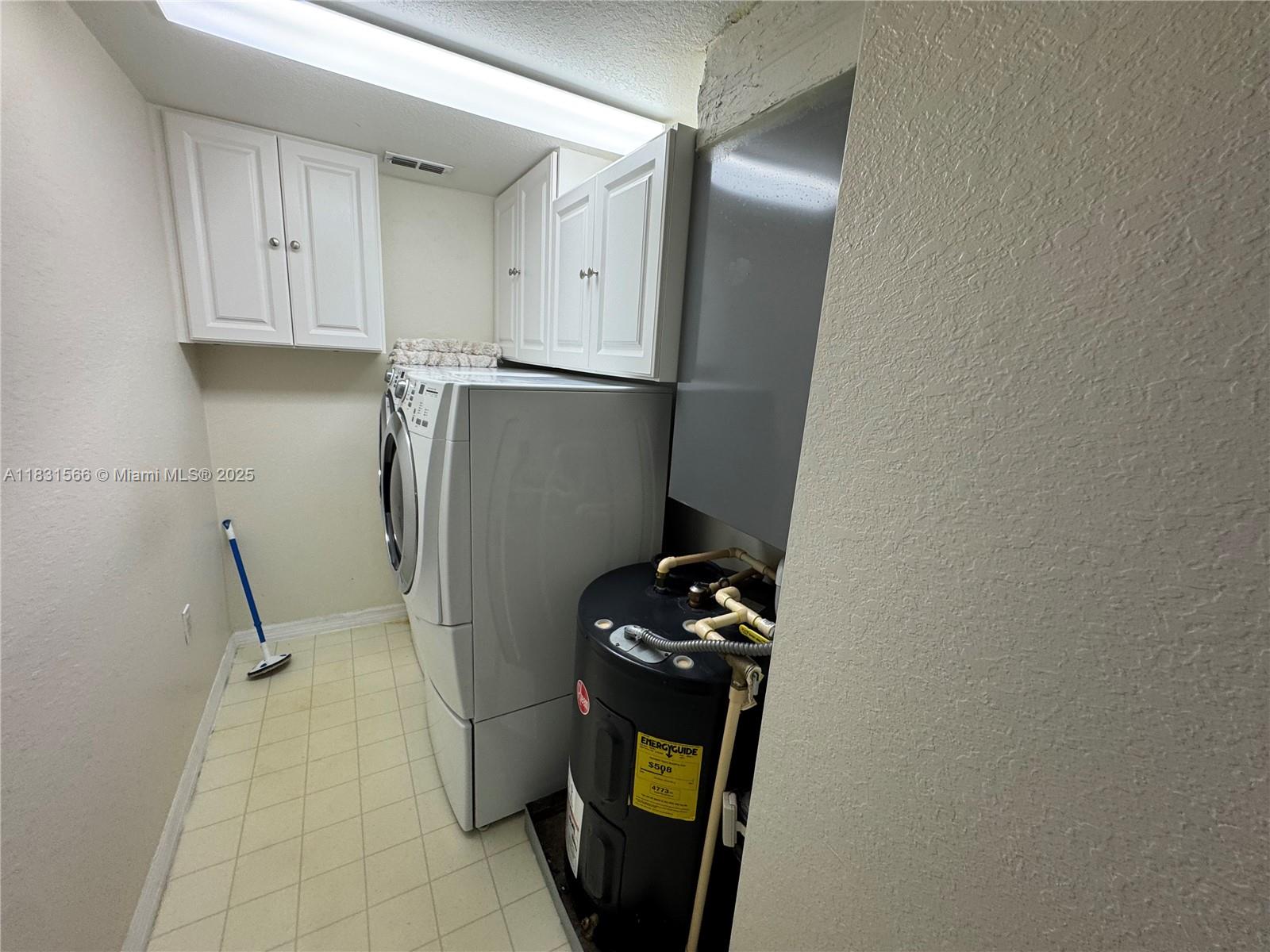 8244 Key Royal Circle, Unit 633 Naples, FL 34119 - Photo 18 of 37 a kitchen with a refrigerator and a stove