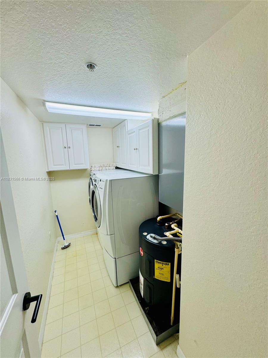 8244 Key Royal Circle, Unit 633 Naples, FL 34119 - Photo 20 of 37 a kitchen with a refrigerator and a stove top oven