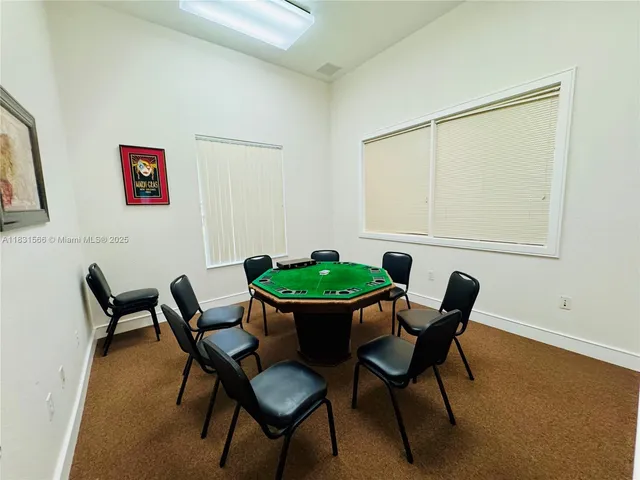 a dining room with a table and chairs