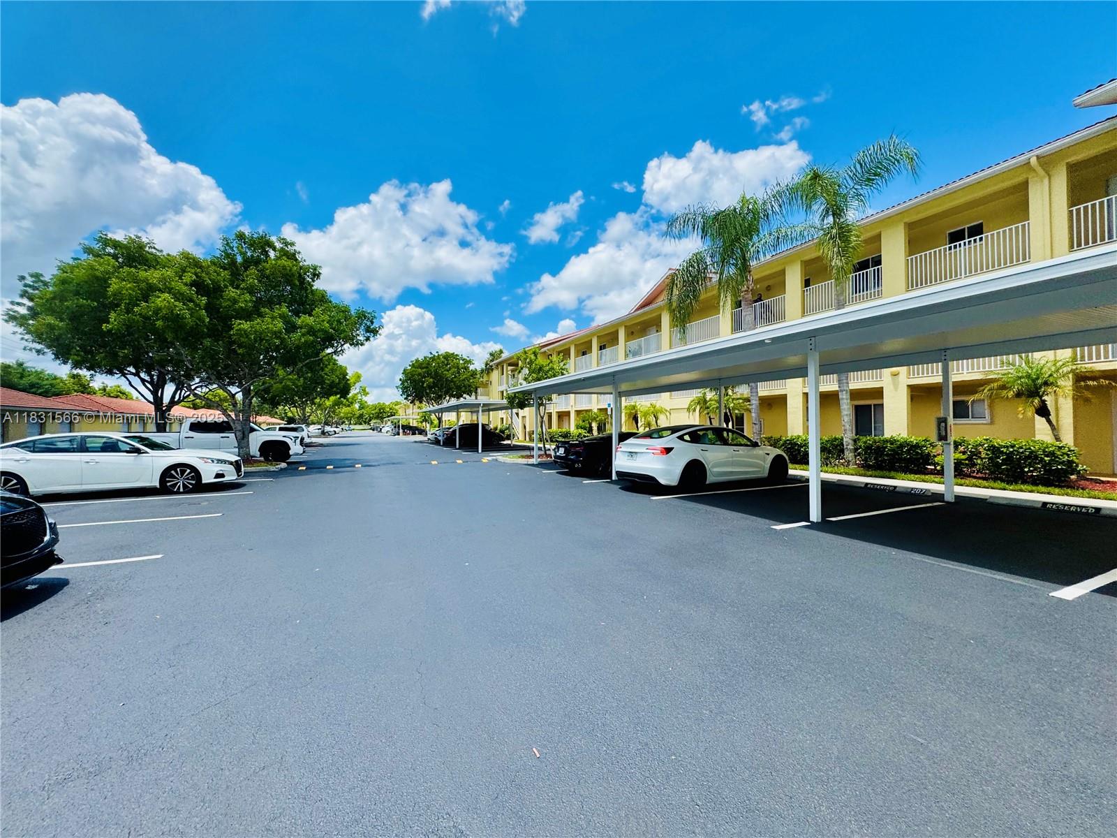 8244 Key Royal Circle, Unit 633 Naples, FL 34119 - Photo 3 of 37 a view of a street with cars
