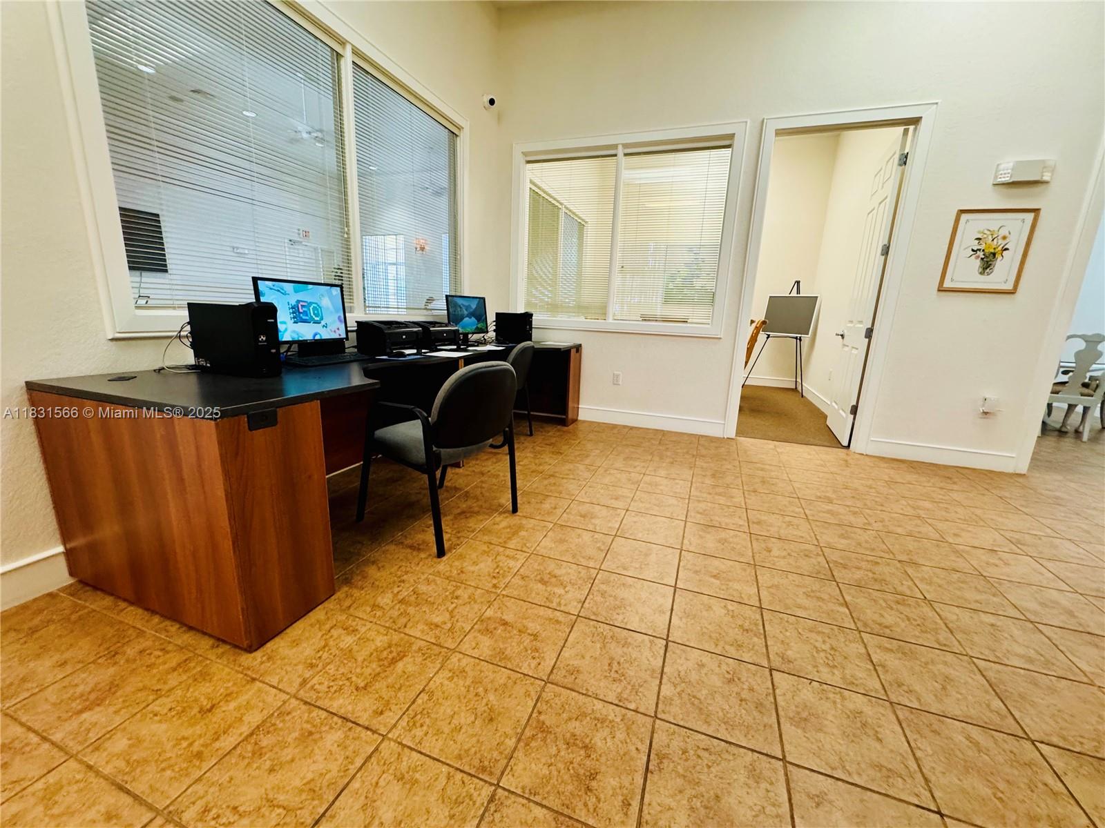 8244 Key Royal Circle, Unit 633 Naples, FL 34119 - Photo 31 of 37 a living room with a couch and a coffee table