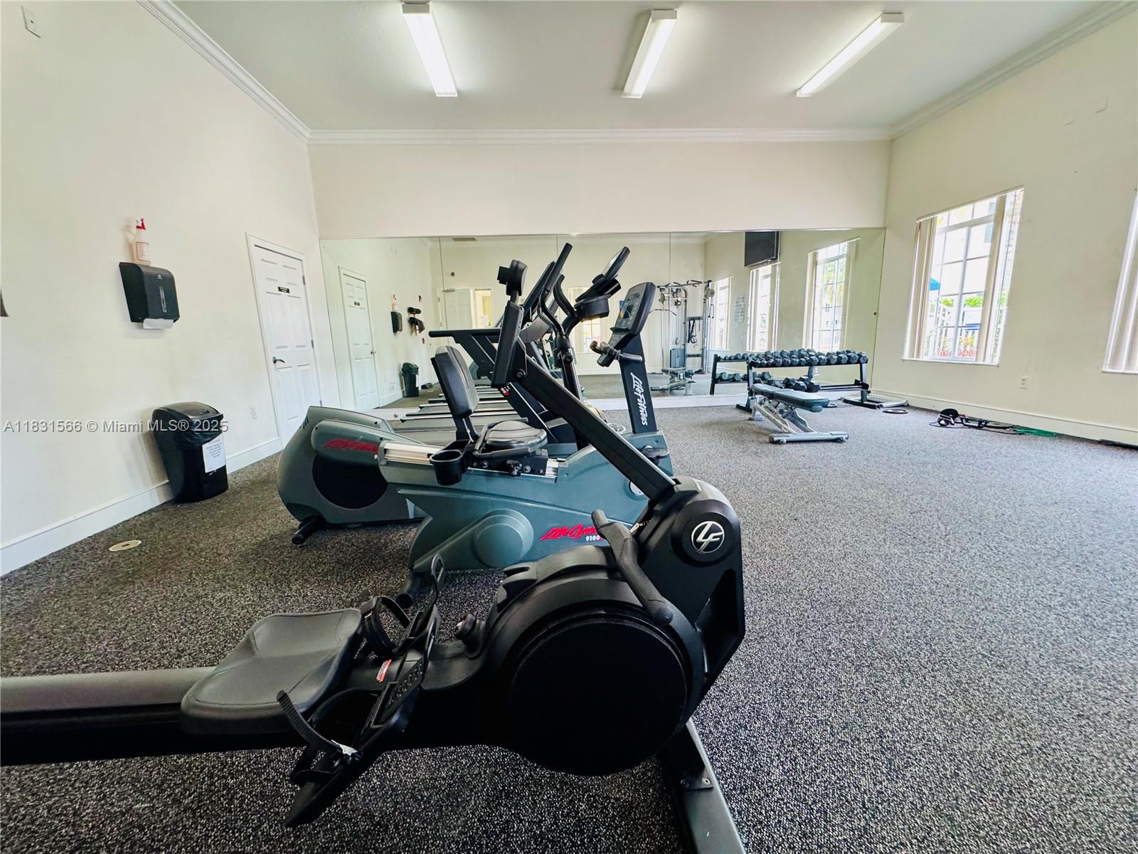 8244 Key Royal Circle, Unit 633 Naples, FL 34119 - Photo 36 of 37 a view of a room with gym equipment