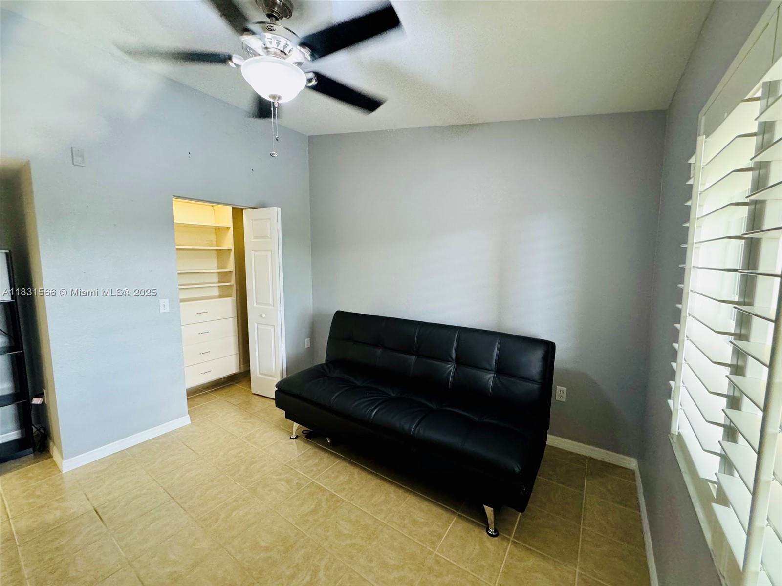 8244 Key Royal Circle, Unit 633 Naples, FL 34119 - Photo 6 of 37 a living room with furniture and a window