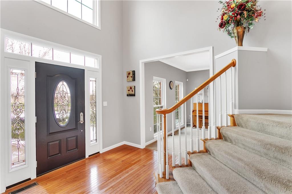 403 Meadow View Drive McKees Rocks, PA 15136 - Photo 4 of 25 a view of an entryway with wooden floor and front door