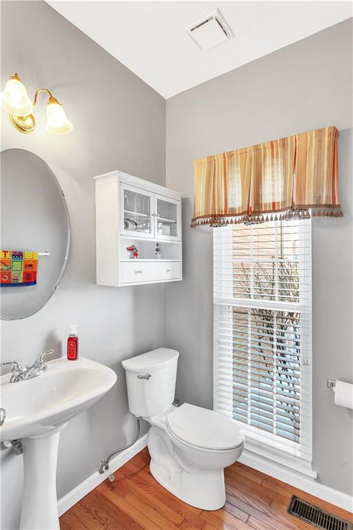 403 Meadow View Drive McKees Rocks, PA 15136 - Photo 7 of 25 a bathroom with a sink toilet and window