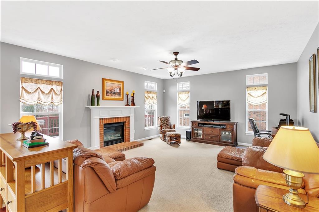 403 Meadow View Drive McKees Rocks, PA 15136 - Photo 8 of 25 a living room with furniture fireplace and flat screen tv
