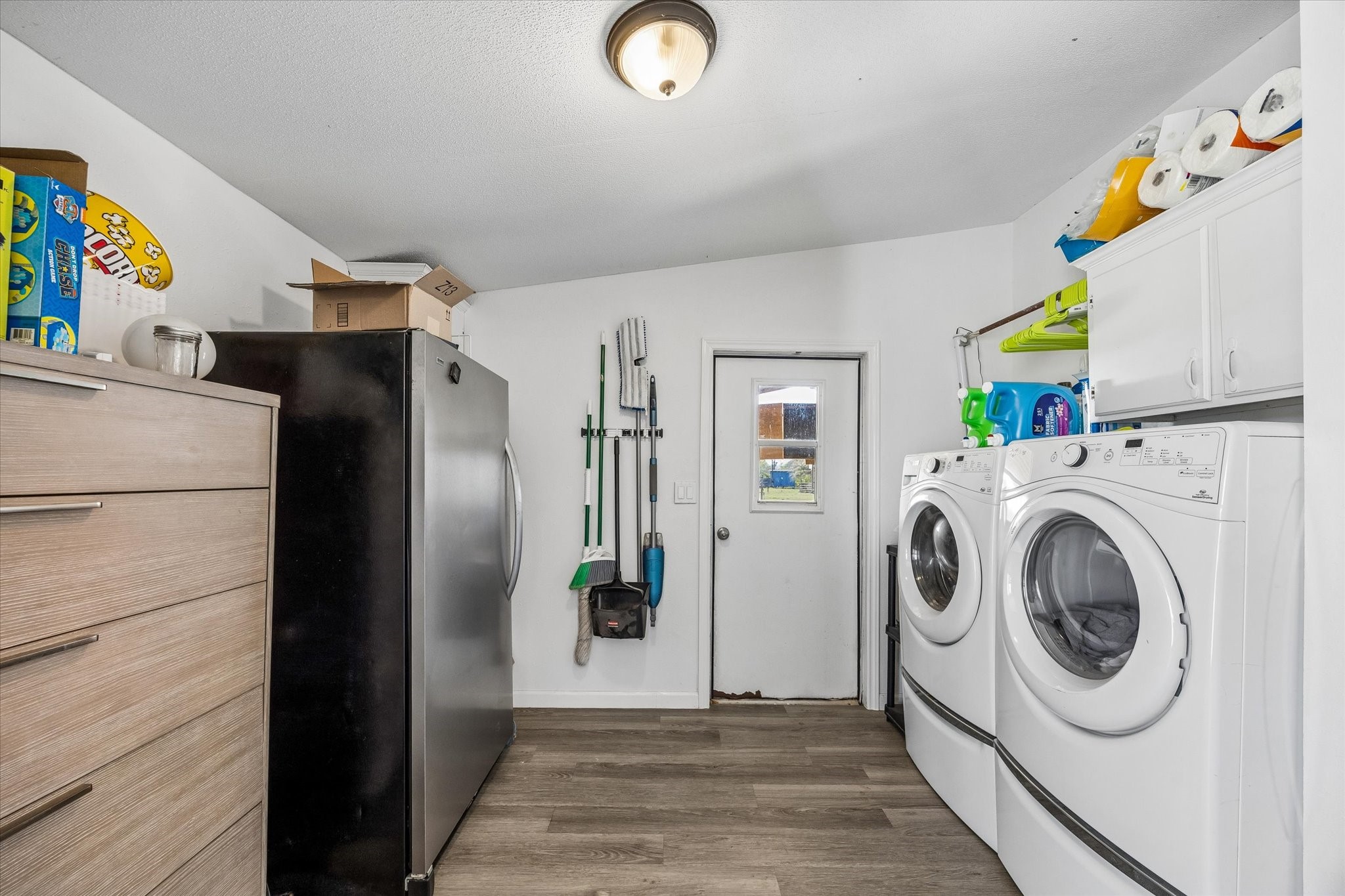 41230 Delma Road Hempstead, TX 77445 - Photo 17 of 23 Roomy utility room with room for washer / dryer / freezer and extra storage.