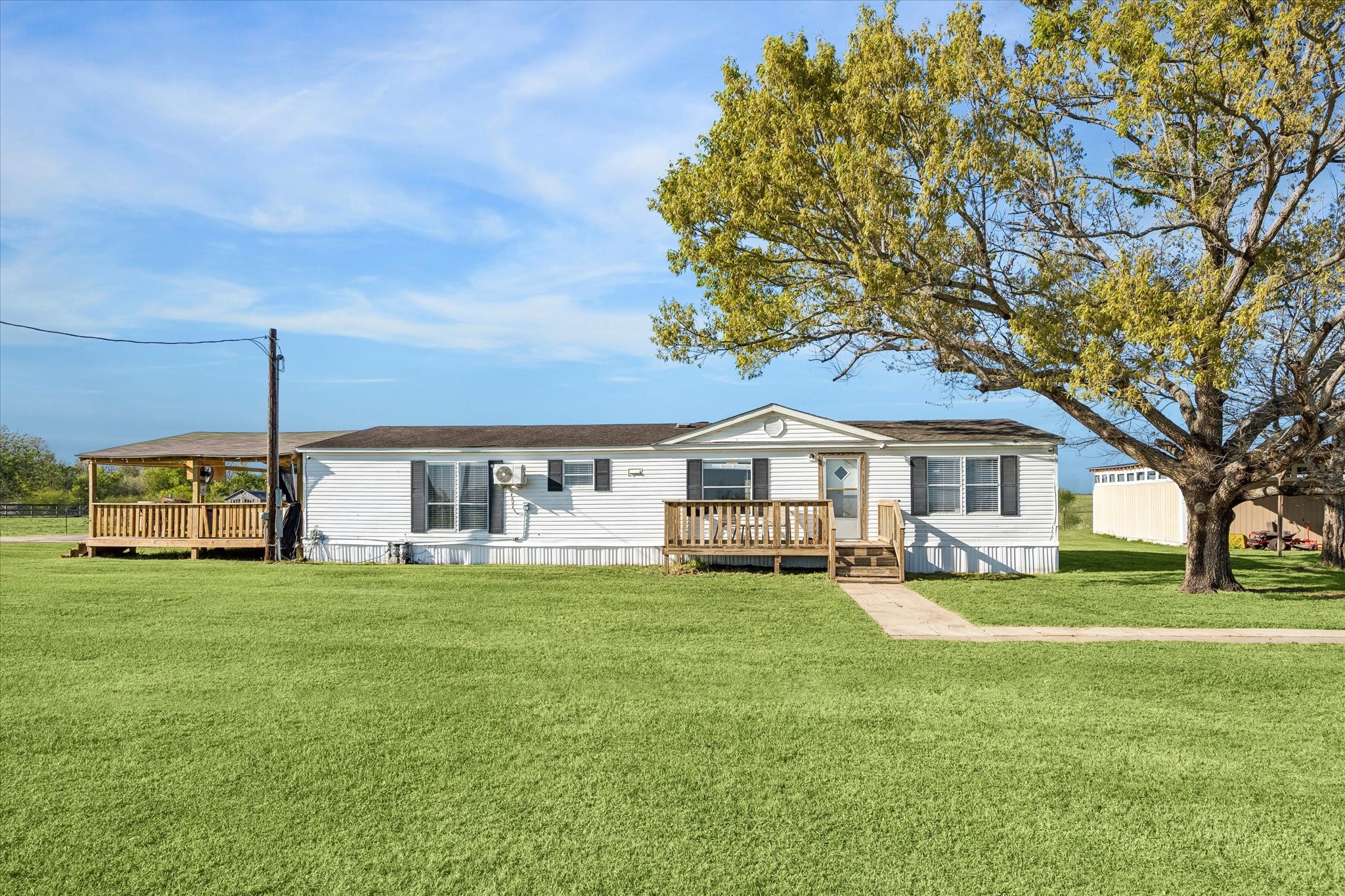 41230 Delma Road Hempstead, TX 77445 - Photo 3 of 23 Home with a large covered deck and workshop / carport.