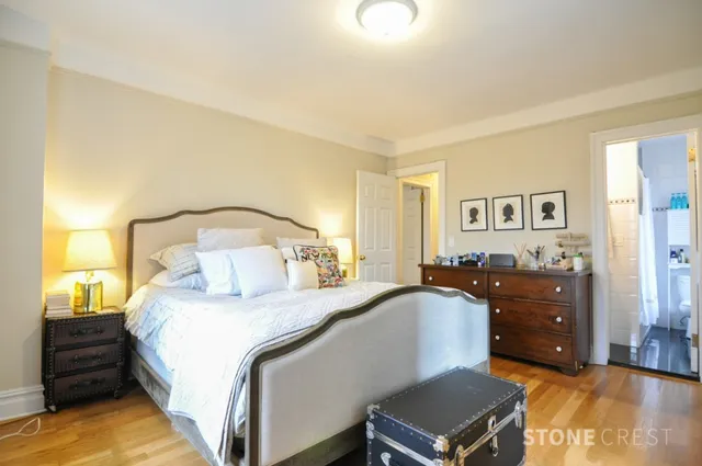 a bedroom with a bed and a mirror